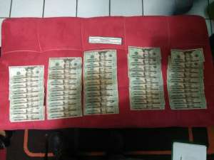 Entre las evidencias encontradas hubo $ 980 en billetes de $ 20. Foto: Fabricio Cruz / El Tel&eacute;grafo