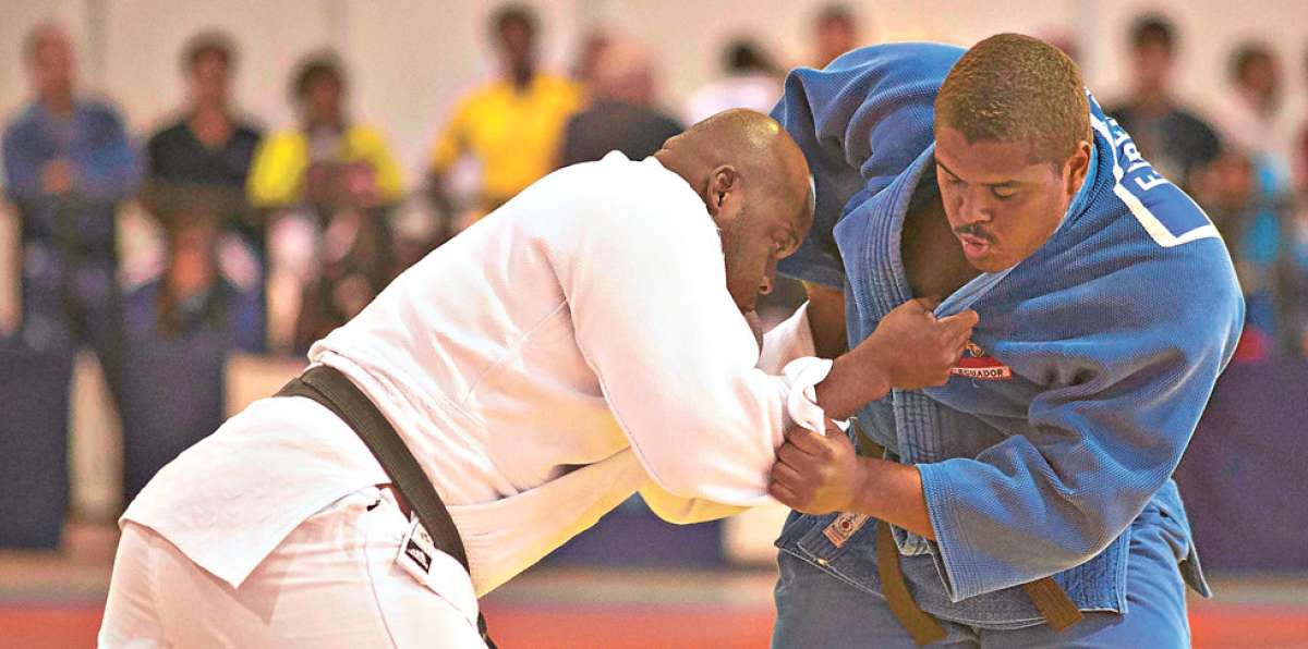 Freddy Figueroa (d) se subi&oacute; al podio (tercero) en el Panamericano, tras derrotar al mexicano Cuevas en el repechaje. Foto: Archivo / El Tel&eacute;grafo