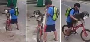 Ni&ntilde;o le coloca mascarilla a su perrito antes de pasear en bicicleta por barrio de Ambato